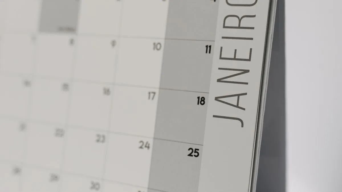 Close-up of a desk calendar open to the month of January.